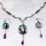 Green purple glass beads and sterling silver earrings, lampwork flameworked bead and silver earring and necklace set, sterling silver glass bead and amethyst earrings and pendant by Leslie Stewart of Art by LK Stewart Bend OR Sunriver OR