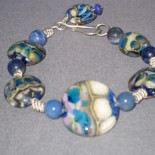 Glass handmade flameworked lampwork beads with sodalite and sterling silver bracelet by Leslie Klipper Stewart for Art by LK Stewart
